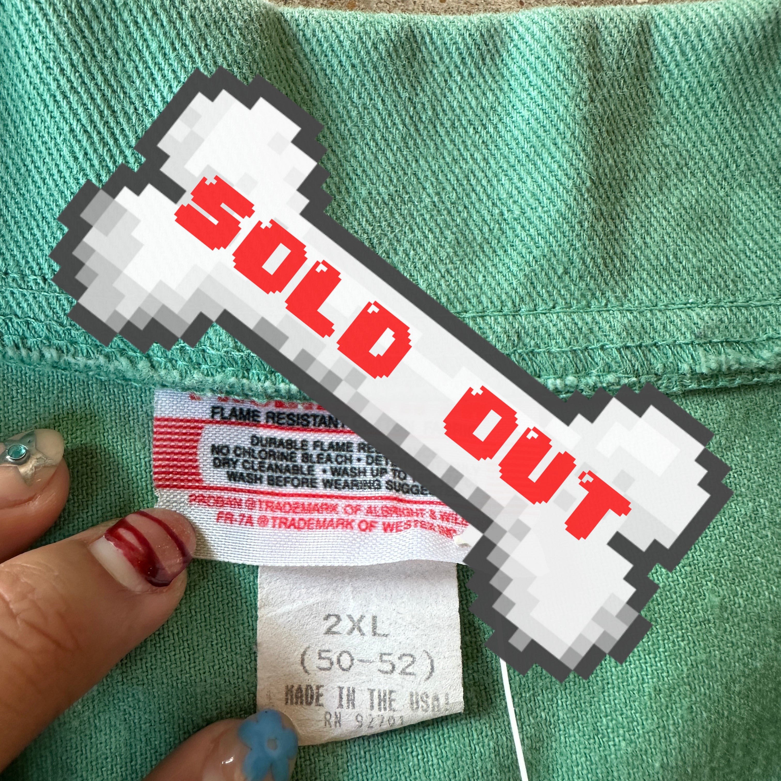 VTG green chore coat with skull design!