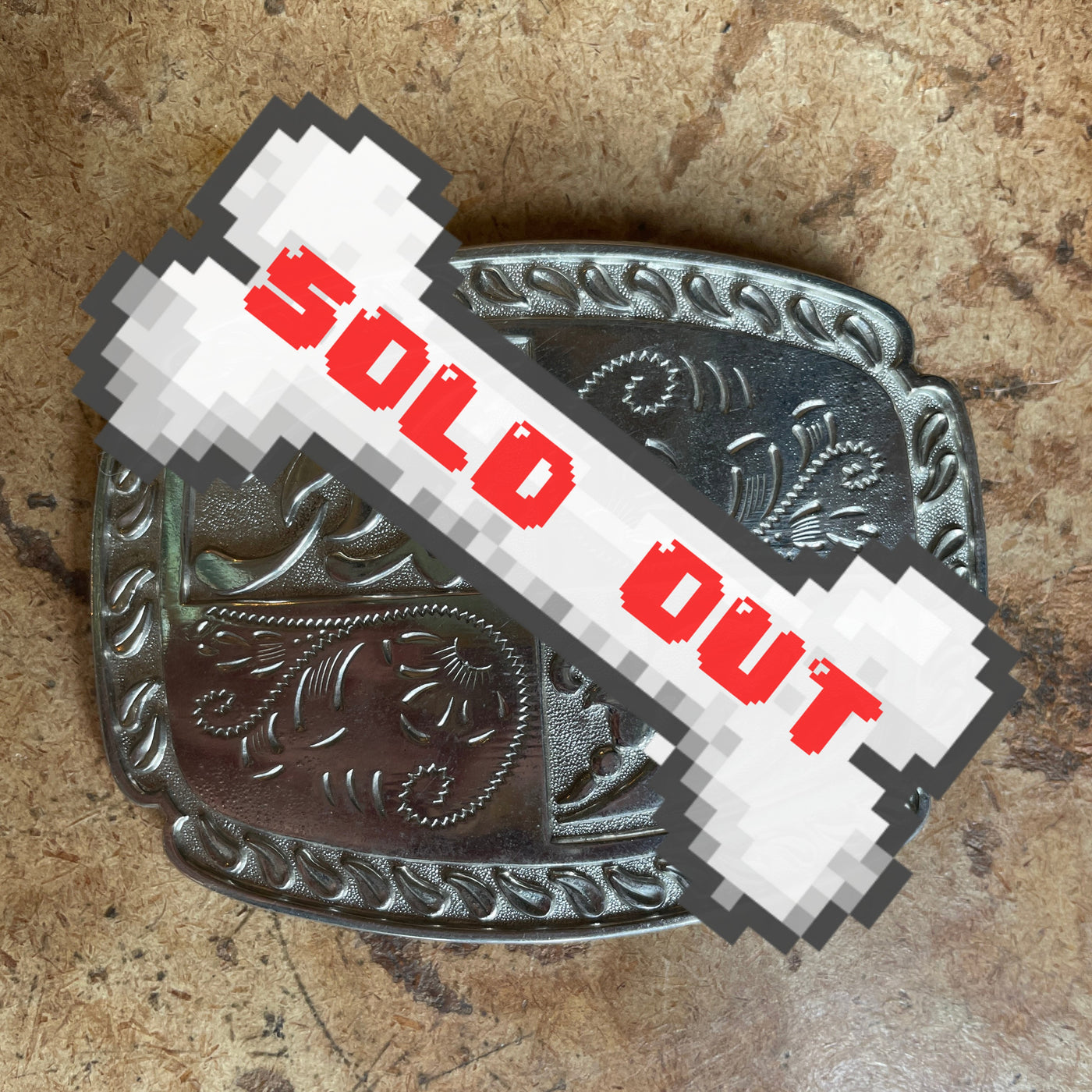 vintage belt buckle with floral/paisley design