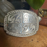 vintage belt buckle with floral/paisley design