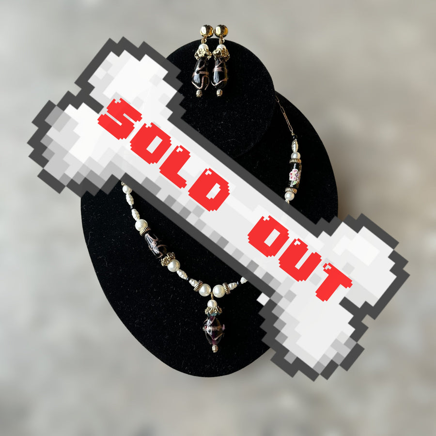 vintage gold-tone and necklace and earring set with black glass and faux pearl detailing