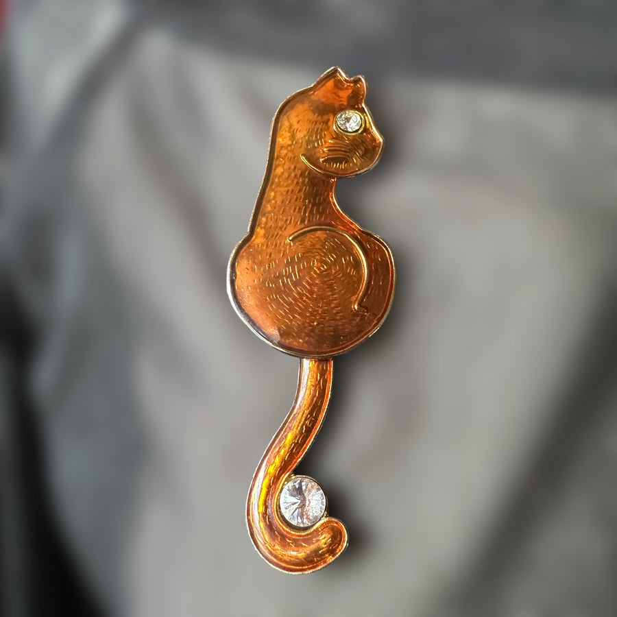 vintage orange enamel cat brooch with articulated swinging tail
