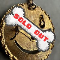 vintage smiley face brooch and pendant with articulated rhinestone eyes