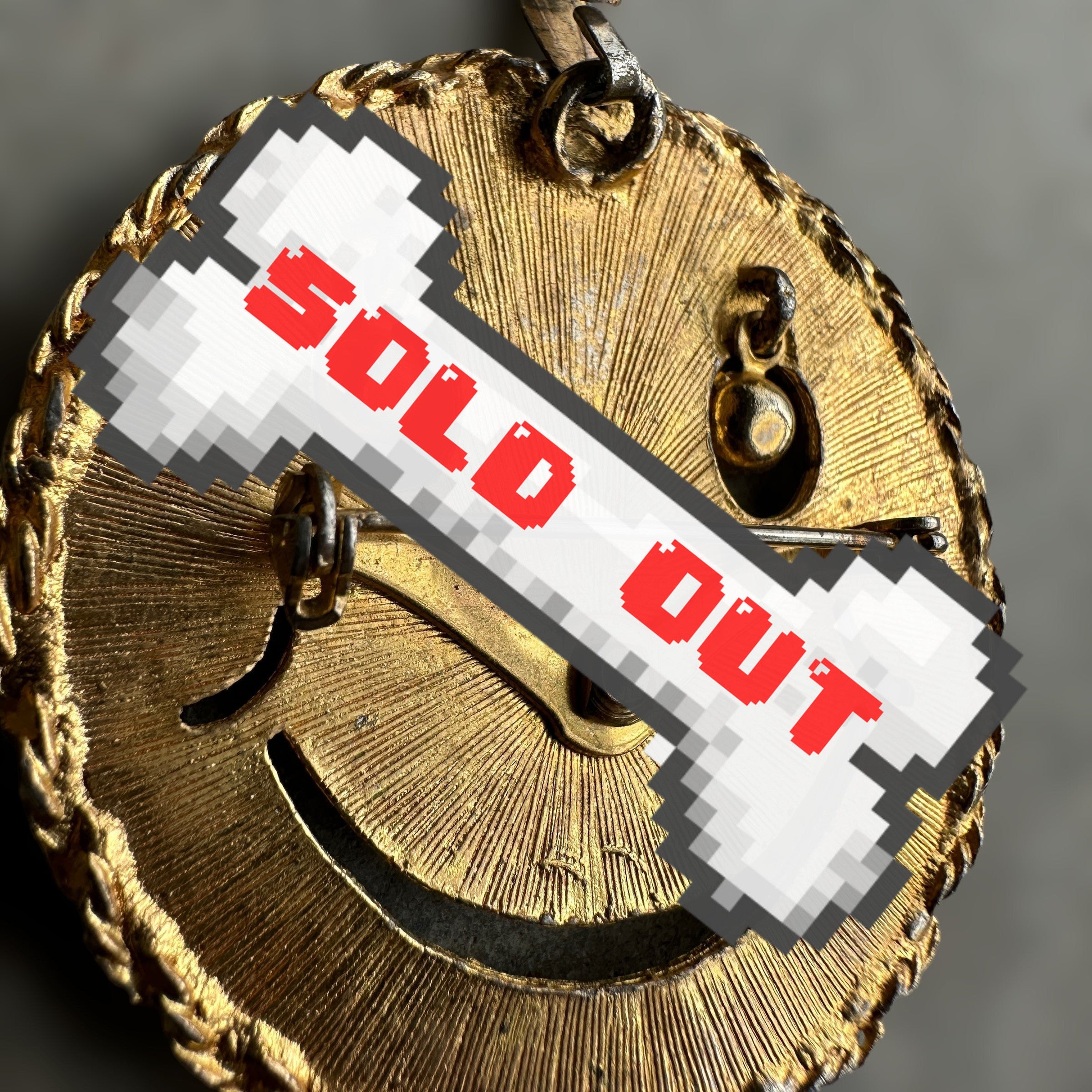 vintage smiley face brooch and pendant with articulated rhinestone eyes